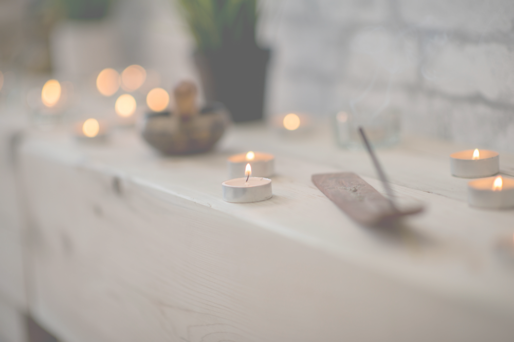 An altar with incense and small candles.